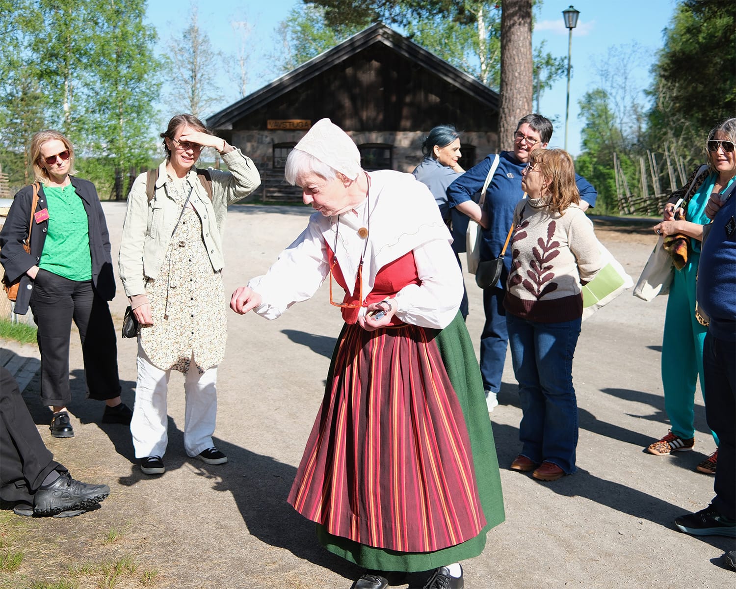 Brunskog Hembygdsgård chair Mia Brodin showing the Folk Museum facilities.