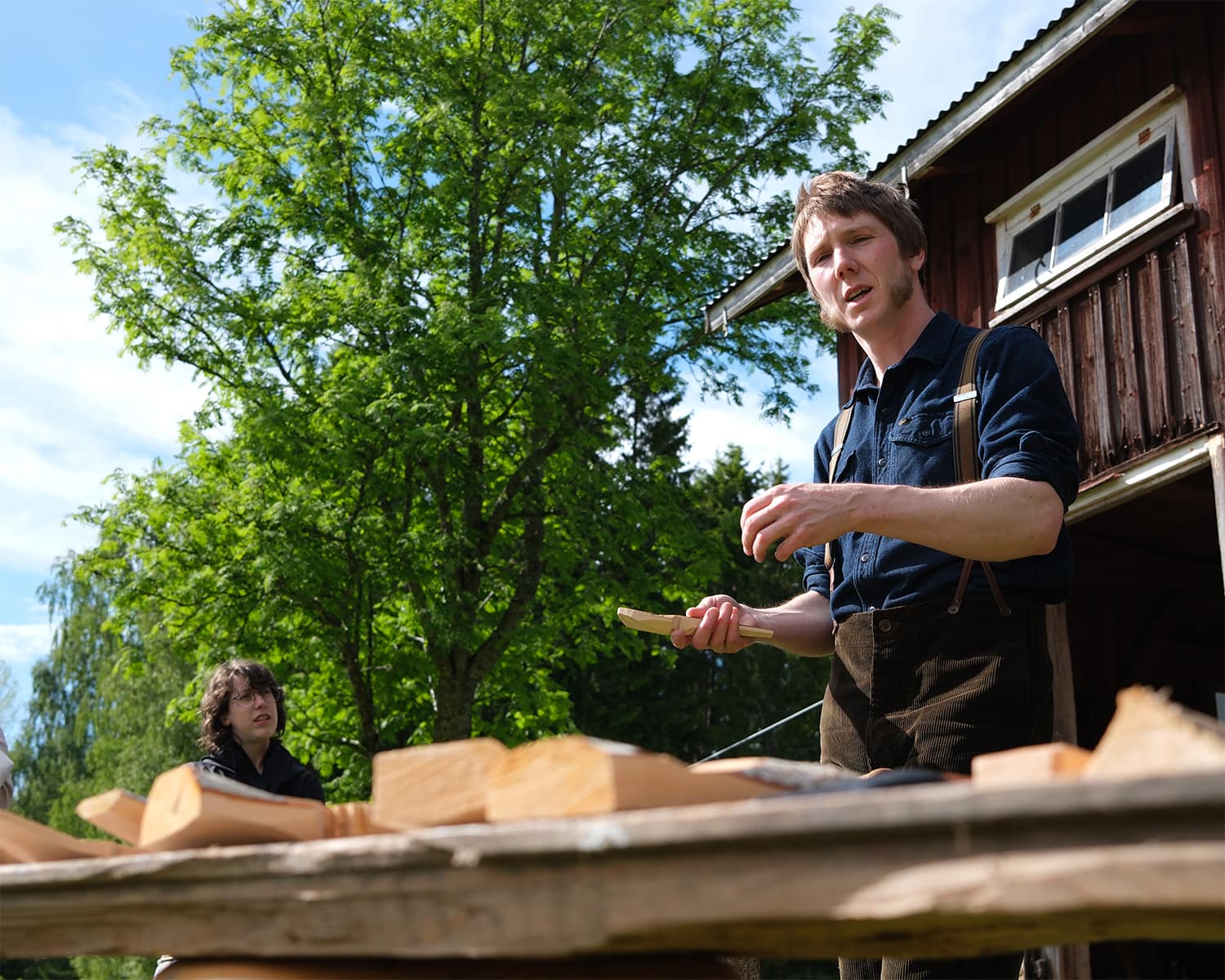 Frej Lonnfors demonstrates his craft at his and Karin Edlund's workshop.