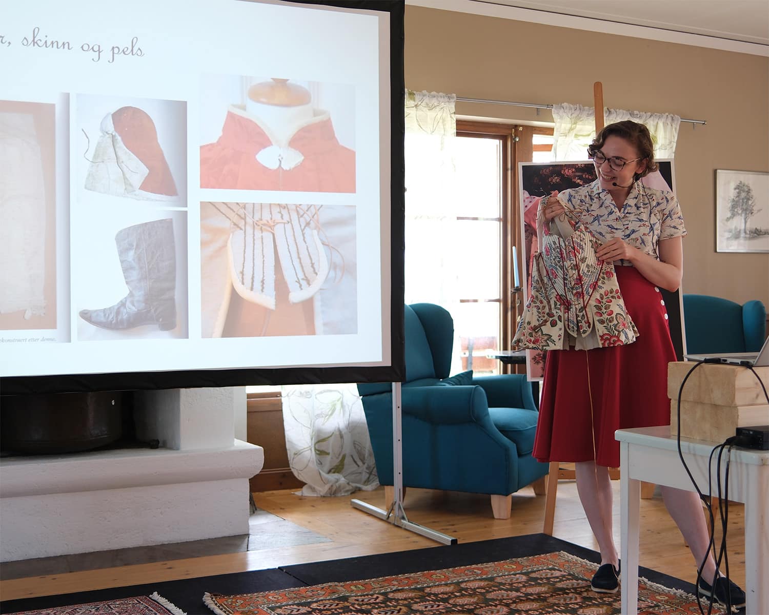 Julie Mari Brevik giving a presentation on Norwegian traditional costumes.