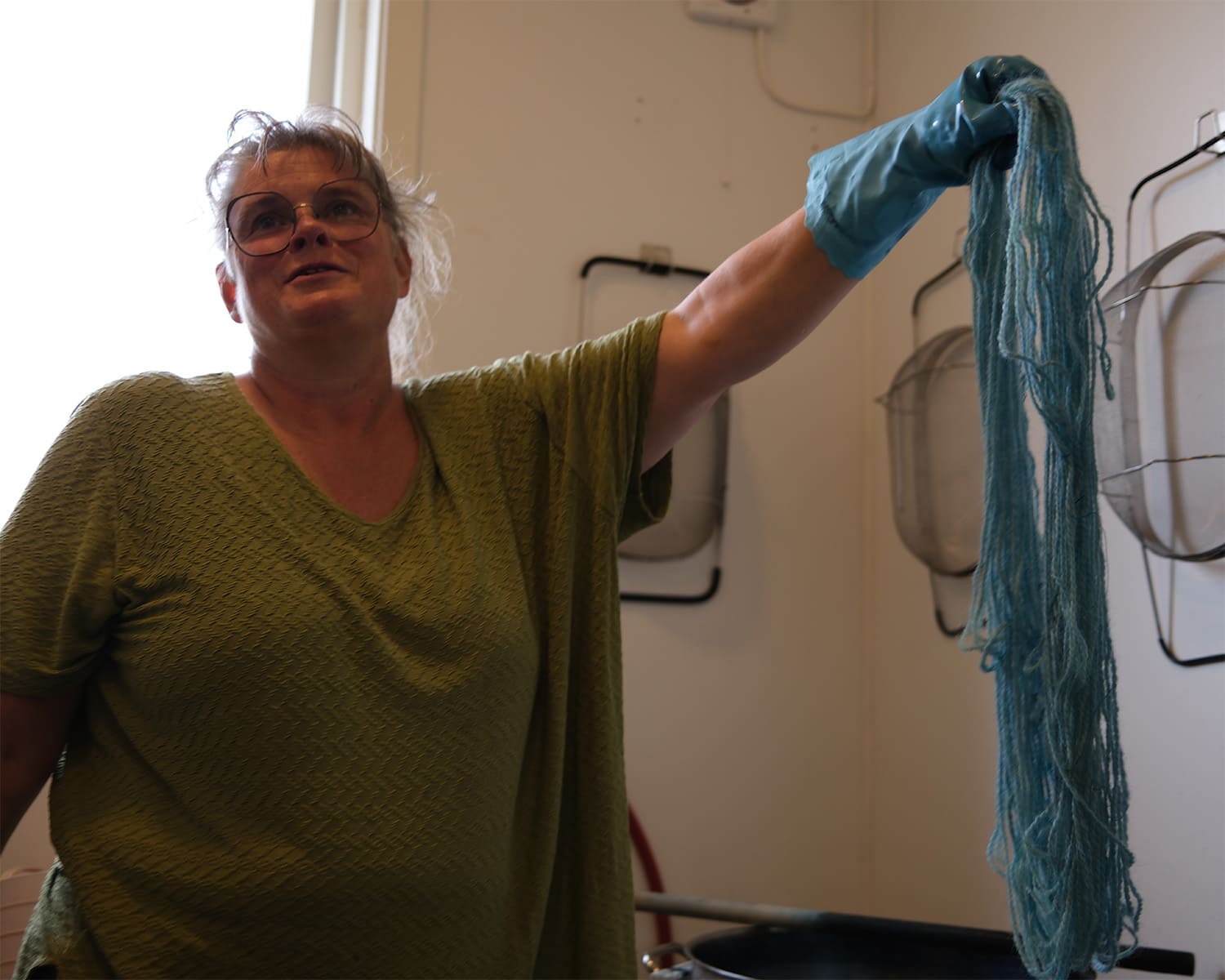 A craftswoman during a demonstration at Lofoten Wool.